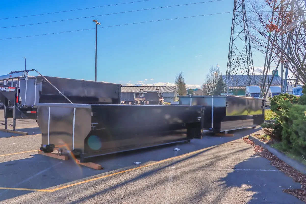 Roll-off dumpster ready for waste disposal at job site for Concrete Dumpster Rental in Gulf Hills